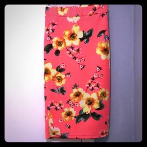 Coral pencil skirt with tropical floral pattern